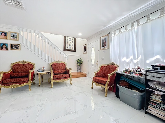 sitting room with ornamental molding