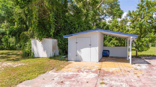 view of outbuilding with a yard