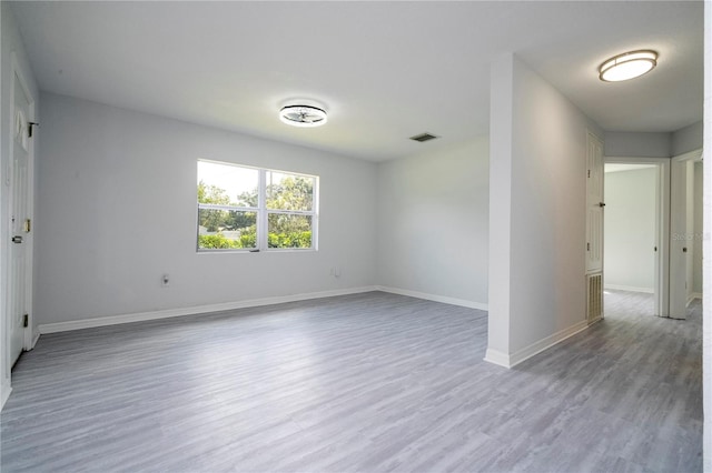 unfurnished room with light hardwood / wood-style floors