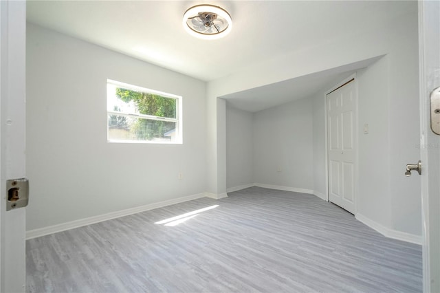 empty room with light hardwood / wood-style floors