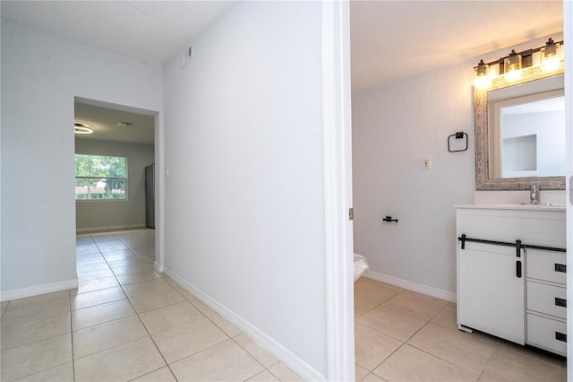 bathroom featuring vanity, toilet, and tile patterned flooring