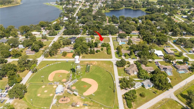 birds eye view of property with a water view