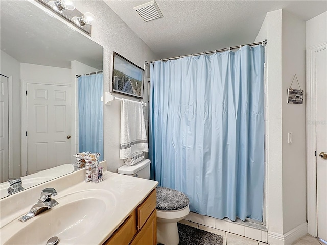 bathroom featuring a textured ceiling, a shower with curtain, tile patterned floors, vanity, and toilet