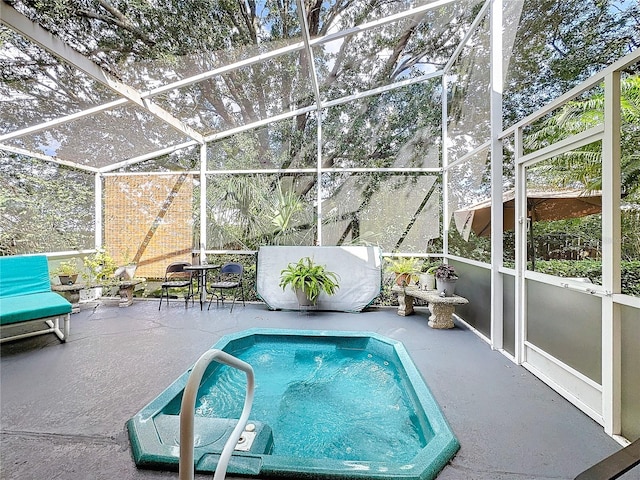 view of swimming pool with a patio and glass enclosure