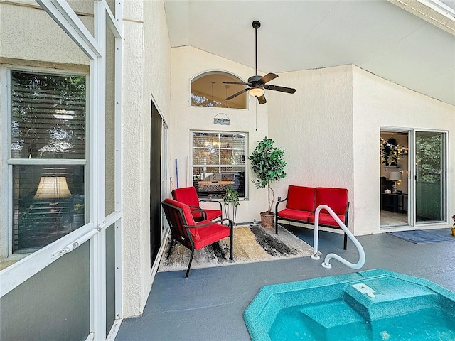 view of pool with a patio and ceiling fan