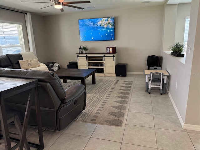 living room with light tile patterned flooring and ceiling fan