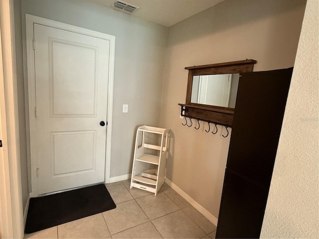 2346 Upland Ln, Apopka, FL 32712 - doorway to outside featuring light tile patterned floors and baseboards
