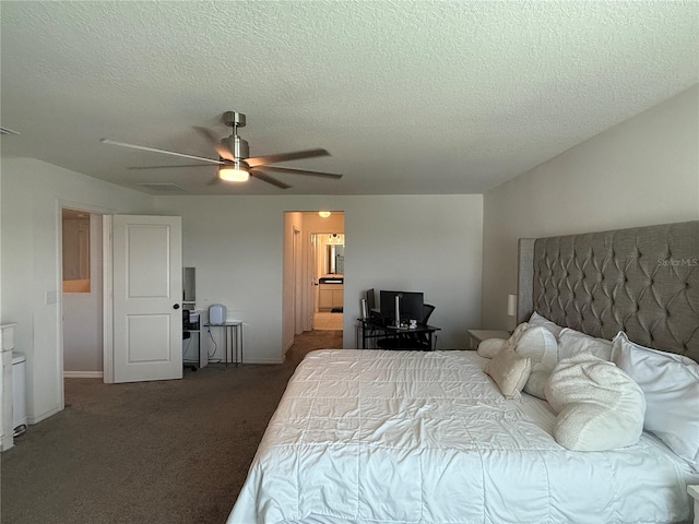 carpeted bedroom with ceiling fan and a textured ceiling