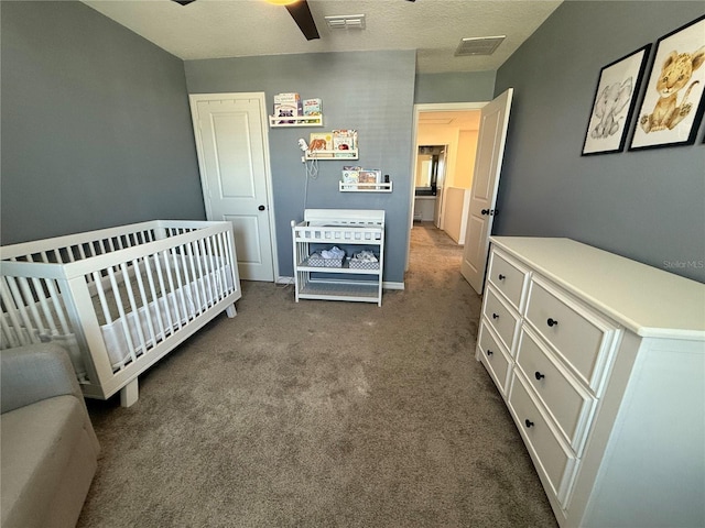 2346 Upland Ln, Apopka, FL 32712 - carpeted bedroom featuring a crib, a ceiling fan, and baseboards
