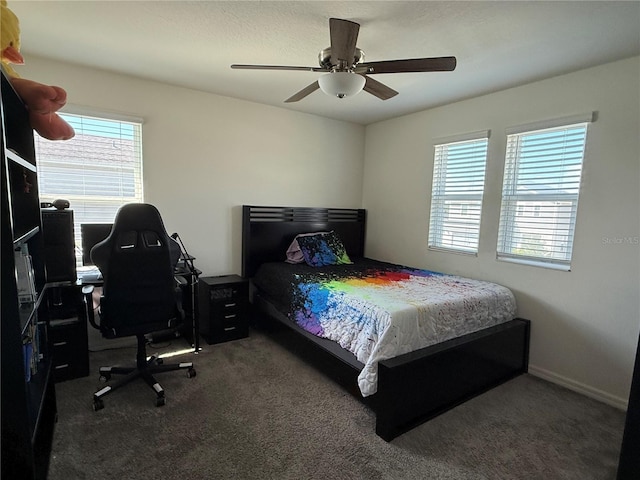 carpeted bedroom with ceiling fan