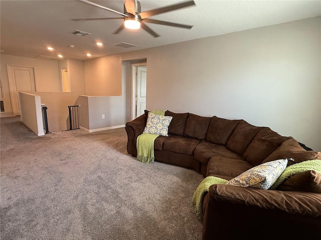 carpeted living room with ceiling fan