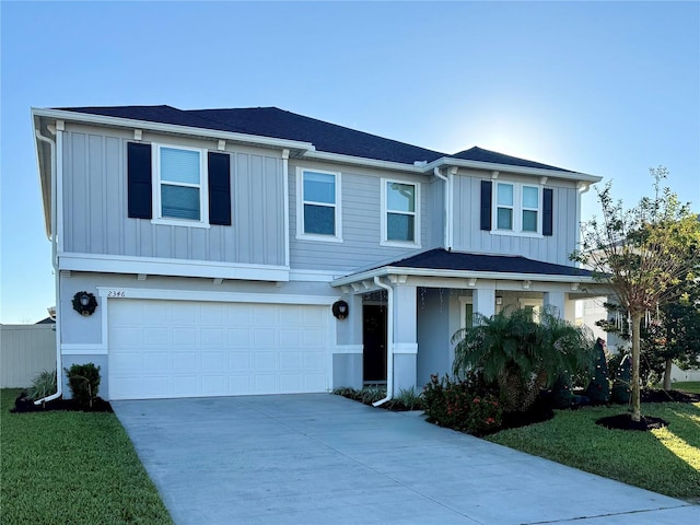 view of front facade with a front lawn and a garage