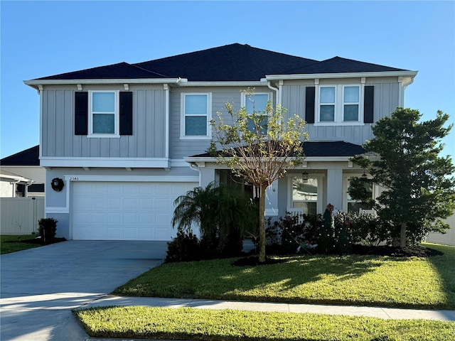2346 Upland Ln, Apopka, FL 32712 - view of front facade with board and batten siding, an attached garage, concrete driveway, and a front lawn