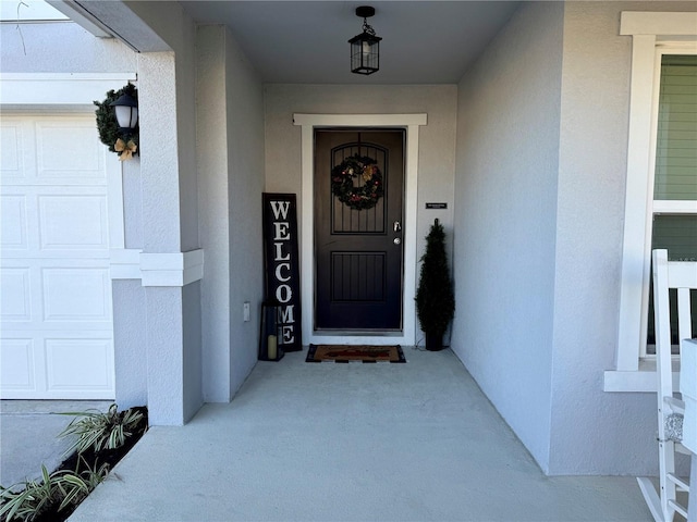 2346 Upland Ln, Apopka, FL 32712 - doorway to property featuring stucco siding and a garage