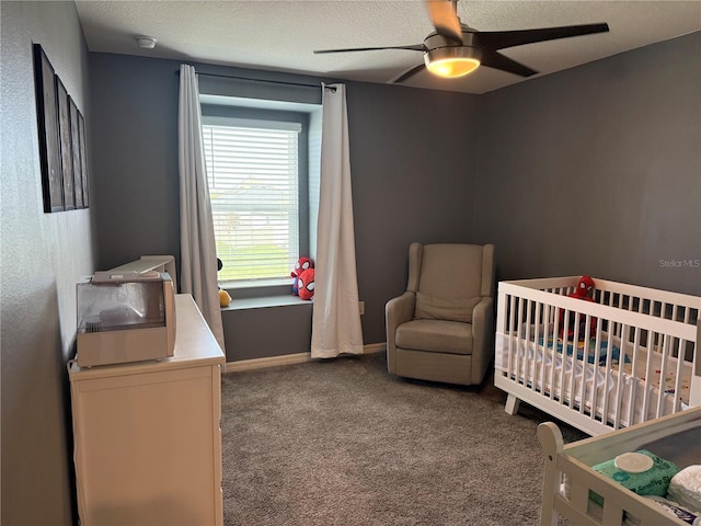 2346 Upland Ln, Apopka, FL 32712 - bedroom with carpet flooring, a nursery area, a ceiling fan, baseboards, and a textured ceiling