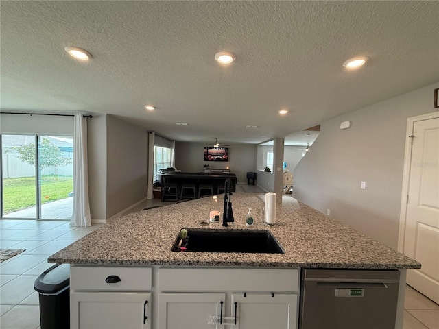 2346 Upland Ln, Apopka, FL 32712 - kitchen featuring a sink, open floor plan, stainless steel dishwasher, white cabinets, and recessed lighting