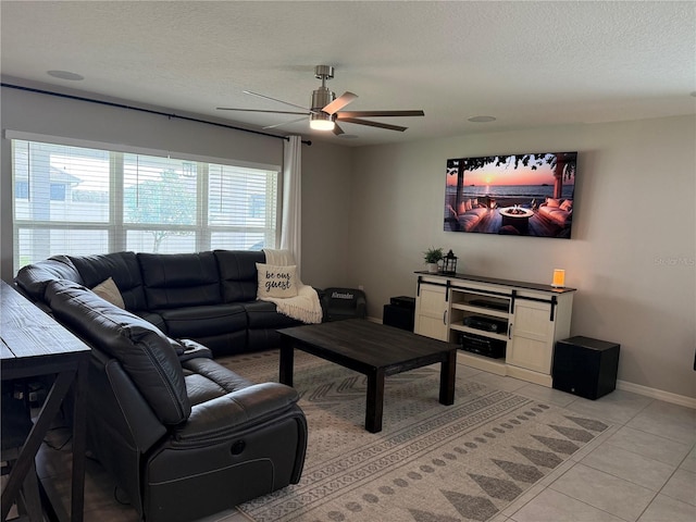 2346 Upland Ln, Apopka, FL 32712 - living area with ceiling fan, light tile patterned floors, a textured ceiling, and baseboards