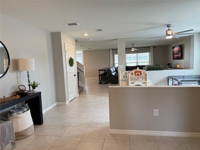 2346 Upland Ln, Apopka, FL 32712 - kitchen with a ceiling fan, light tile patterned floors, baseboards, and open floor plan