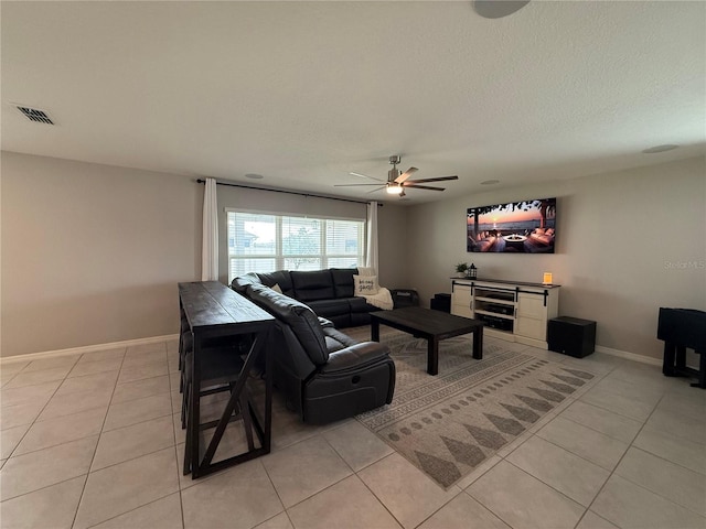 2346 Upland Ln, Apopka, FL 32712 - living area with light tile patterned flooring, ceiling fan, baseboards, and a textured ceiling