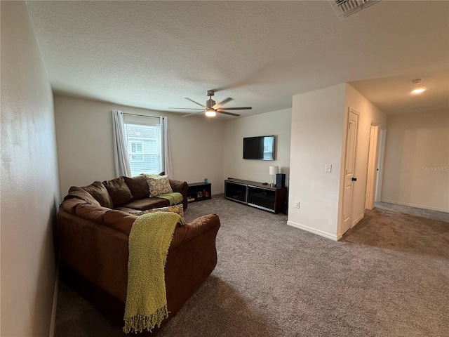 2346 Upland Ln, Apopka, FL 32712 - living room with ceiling fan, carpet flooring, a textured ceiling, and baseboards