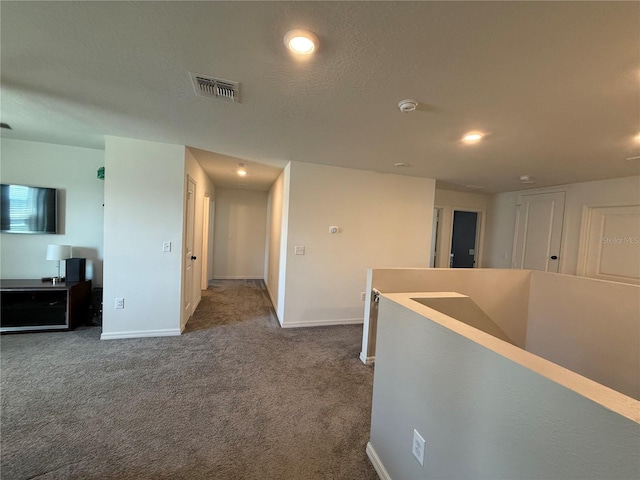 2346 Upland Ln, Apopka, FL 32712 - hall with an upstairs landing, dark colored carpet, baseboards, and recessed lighting