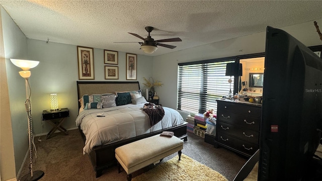 carpeted bedroom with ceiling fan and a textured ceiling