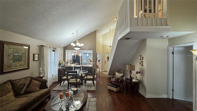 living room featuring a textured ceiling, high vaulted ceiling, dark wood-type flooring, and a notable chandelier