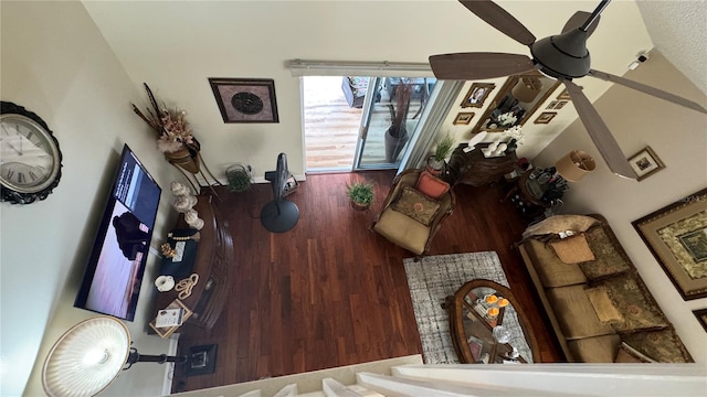 living room with ceiling fan and hardwood / wood-style flooring