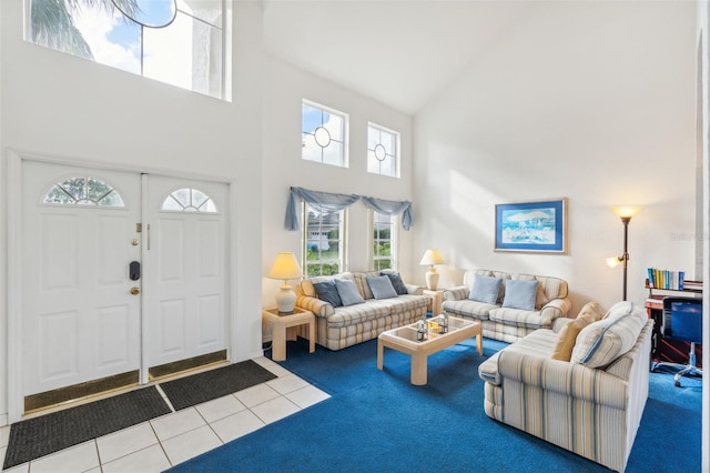 living room featuring high vaulted ceiling and carpet flooring