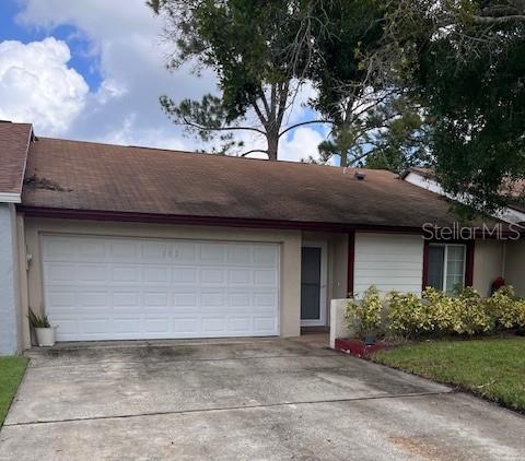 single story home with a garage