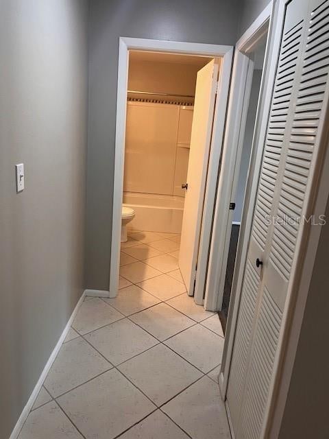 hallway with light tile patterned floors