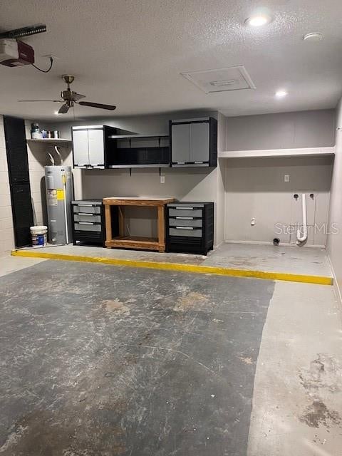 garage featuring a garage door opener, electric water heater, and ceiling fan