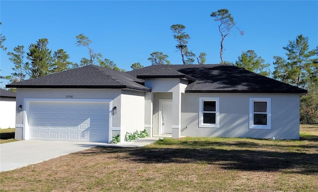 16941 SW 30th Avenue Rd SW, Ocala, FL 34473 - view of front of property with a front yard, a shingled roof, an attached garage, stucco siding, and driveway