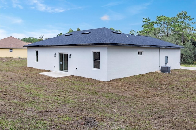 16941 SW 30th Avenue Rd SW, Ocala, FL 34473 - back of property with a yard and stucco siding