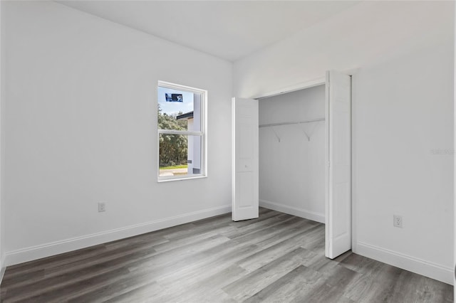 16941 SW 30th Avenue Rd SW, Ocala, FL 34473 - unfurnished bedroom featuring a closet, baseboards, and wood finished floors