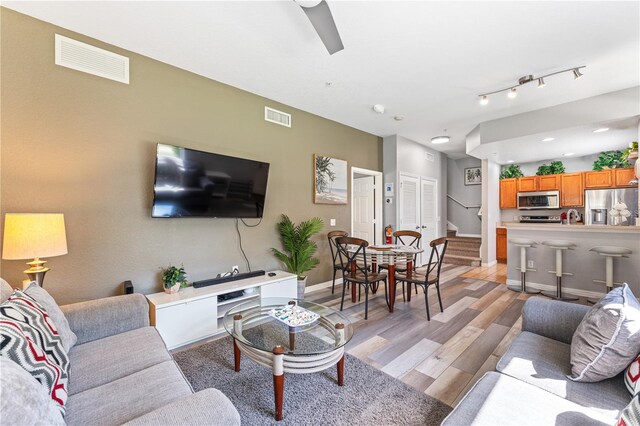 living room with light hardwood / wood-style floors