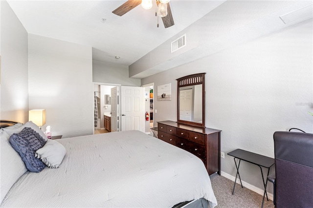 bedroom featuring carpet, ceiling fan, and ensuite bathroom