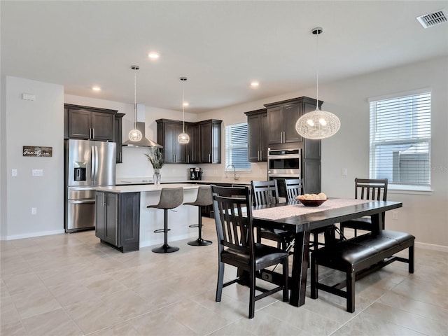 tiled dining space featuring sink