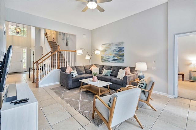 living room featuring ceiling fan and light tile patterned floors