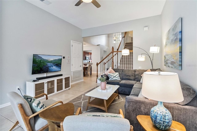 living room with ceiling fan and light tile patterned flooring