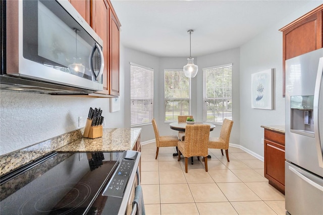 dining space with light tile patterned floors