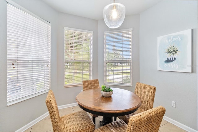 dining space with light tile patterned floors