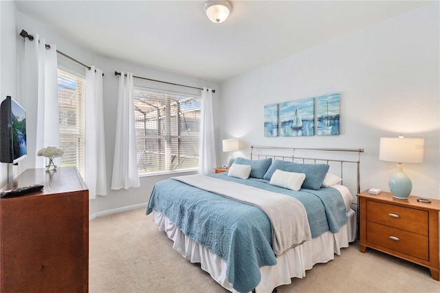 bedroom featuring light colored carpet