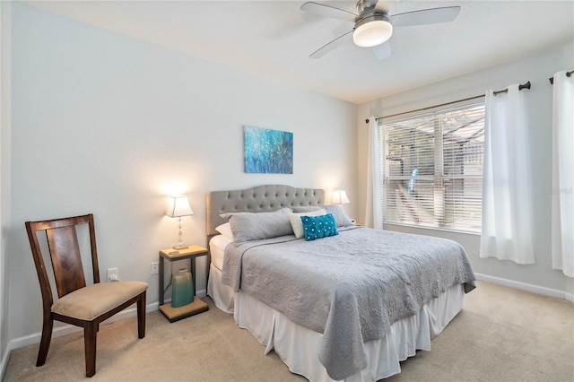 bedroom featuring ceiling fan and light colored carpet