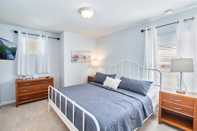 bedroom with light carpet