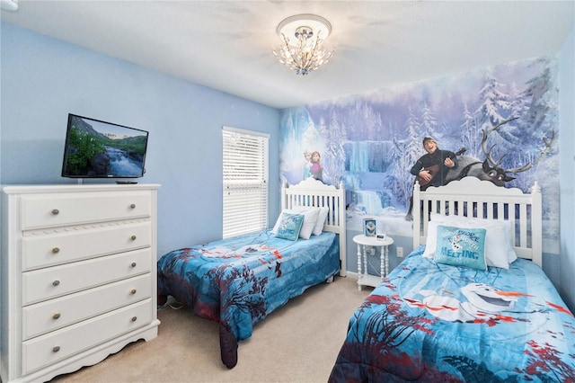 bedroom with an inviting chandelier and light carpet