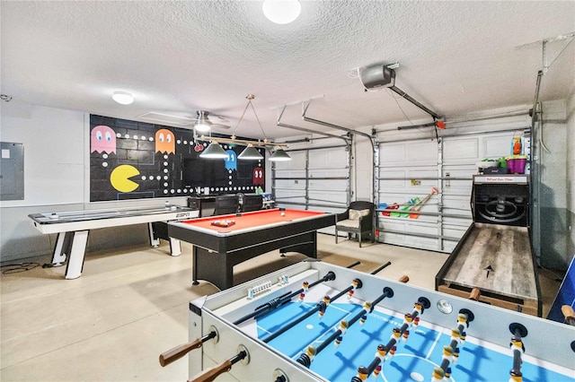 rec room with pool table, a textured ceiling, concrete flooring, and ceiling fan