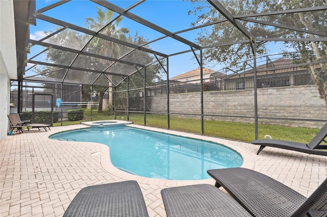 view of swimming pool with a lanai, a patio, and an in ground hot tub