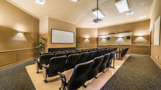 home theater room with light carpet, ornamental molding, and vaulted ceiling