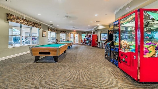 playroom featuring dark carpet, pool table, ceiling fan, and crown molding